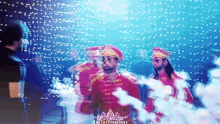 a group of men in red uniforms are standing in front of a blue background that says illusion creations