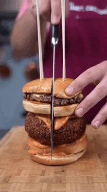Slicing The Burgers Albert Cancook GIF - Slicing The Burgers Albert Cancook Cutting The Burger In Half GIFs