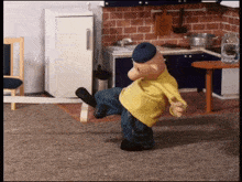 a cartoon character in a yellow shirt is standing on one leg
