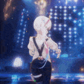 a girl with white hair is standing in front of a stage surrounded by confetti