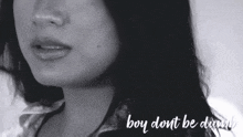 a close up of a woman 's face with the words boy dont be dumb written below her