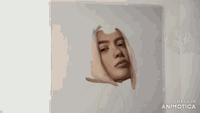 a person is painting a picture of a woman 's face with a brush