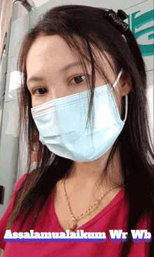 a woman wearing a face mask says assalamualaikum wrwb