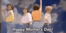 a group of women are dancing together in front of a cloudy sky and saying happy mother 's day .