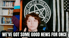 a screen shows a boy in front of a flag that says the satanic circle