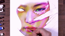 a drawing of a woman 's face is being painted with a brush