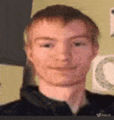 a close up of a man 's face with a blurry background