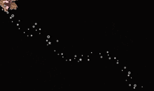 a girl with long hair is surrounded by stars and circles on a black background
