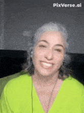a woman with gray hair is wearing headphones and a neon green shirt and smiling .