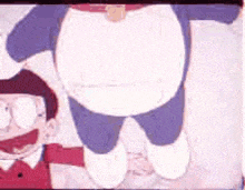 a cartoon of doraemon holding a child 's hand .