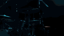 a crowd of people watching a band on stage with their hands in the air