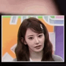 a close up of a woman 's face on a screen .