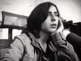 a black and white photo of a woman with the word agifs written on the bottom