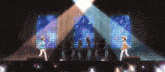 a group of anime girls are dancing on stage