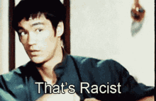 bruce lee says that 's racist in front of a white background