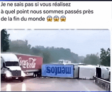 a coca cola truck is on the side of the road next to a mentos truck