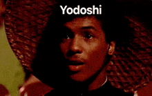 a man is eating something with a spoon and the word yodoshi is written above him