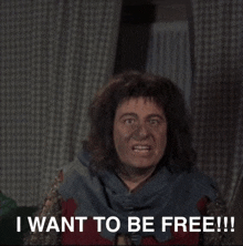 a man with a scarf around his neck says " i want to be free !!! "