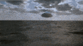 a large iceberg is floating in the ocean .