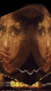a close up of a painting of a face with a yellow stripe on the bottom