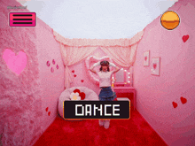 a girl is dancing in a pink room with the word dance on it