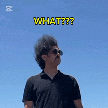 a man wearing sunglasses and a black shirt is asking what
