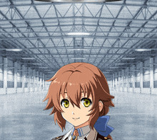 a girl with brown hair and green eyes is standing in an empty building
