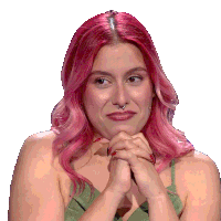 a woman with pink hair and a nose ring is smiling
