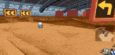 a video game screen shows a skull and a yellow arrow pointing to the left