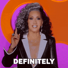 a woman in a tuxedo says " definitely " in white letters