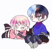 a boy and a girl are sitting next to each other on a bed
