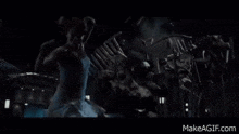 a t-rex is eating a dinosaur in a dark room .