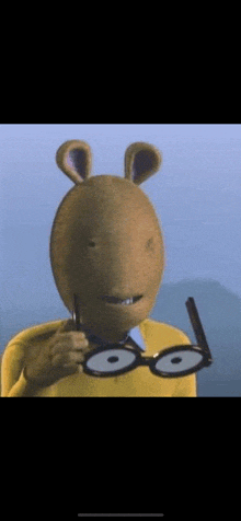 a cartoon character with a rabbit 's head and glasses is smiling .