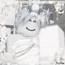a black and white photo of a doll with a smiley face on it .