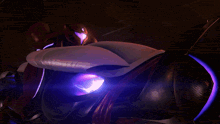 a person riding a futuristic motorcycle with a purple light around the wheel
