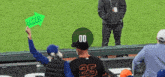 a man wearing a number 25 jersey holds up a sign that says loser
