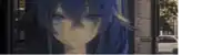 a girl with blue hair looks at the camera