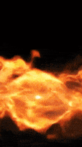 a close up of a fireball against a black background