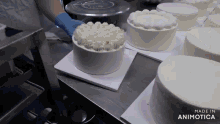 a bunch of cakes on a table with the words made in animatica
