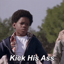 a young boy says kick his ass in a movie