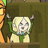 a cartoon character with blonde hair and blue eyes is sitting in front of a green wall