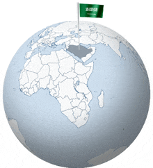 a globe with the flag of saudi arabia on top