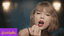 a woman with red lipstick is behind a purple box that says @sirjallu