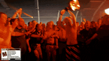 a blurred image of a crowd of people with a warning label on the bottom