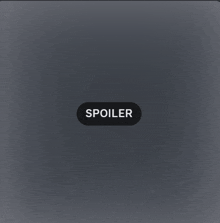 a gray background with a spoiler button on it