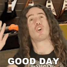 a man with long curly hair is making a funny face and says good day