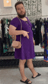 a man in a purple dress is holding a purse