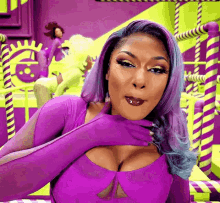 a woman with purple hair is wearing purple gloves and a purple top