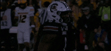a football player wearing a jersey with the number 12 on it
