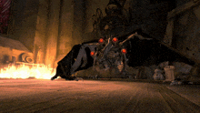 a monster with red eyes is in a dark room